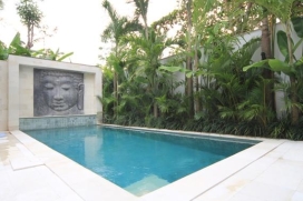 On walking distance from the restaurants and shops of Jalan Oberoi, but with the privacy afforded by the secluded location half way of a 50-meters semi-private alleyway, this modern chic three bedroom holiday villa, built in 2011, is located in the m, Seminyak