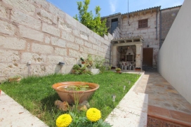 Is in a stunning location on the gentle lower slopes of the Puig de Maria mountain, accessible up a country track next to the famous monument, just off the Pollenca road. It has spectacular views over the old town of Pollenca to the wooded hills beyo, Pollensa